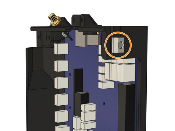 Loosely thread a t-nut onto the screw from the outside of the case. Do not tighten the T-nut to the case, as we will slide the T-nut into the Z extrusion on the frame.