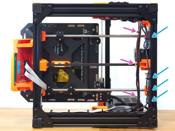 You can now improve the placements of the cables running along the back of the frame and carefully tighten the zip ties.