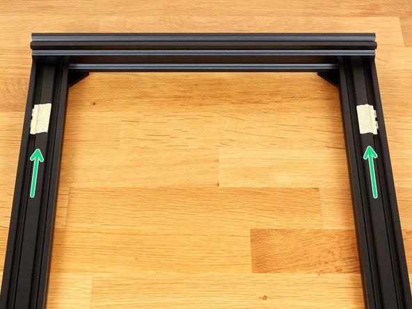 Take the remaining 4 t-nuts, which you previously tested, and slide them into the extrusions as shown in the image.