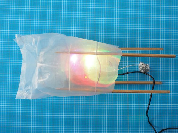 Press and hold the tinfoil ball to scroll through different colours. Let go to select a colour.