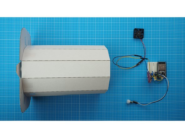 Mount the breadboard to the back of the faceted curve. The breadboard has a double sided tape backing which can be used to attach it.