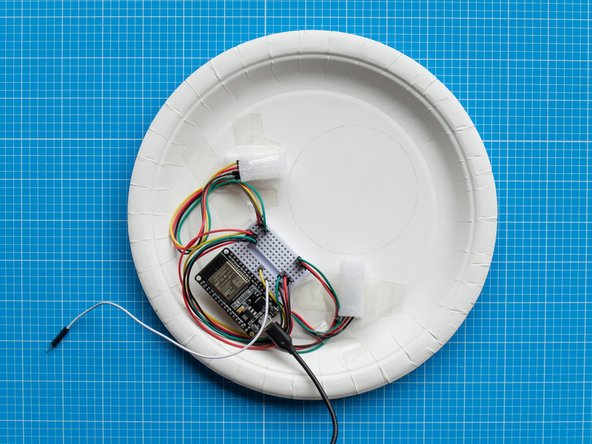 Now that the setup of the LEDs is complete, you can tidy up the cables by securing them to the plate with sellotape.  This will help  to have a tighter fit when you clip the front and back plate together.