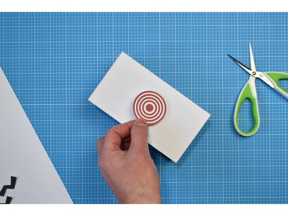 The piezo doesn't necessarily have to be mounted under the target as the box will carry the noise of your tapping to the microphone.