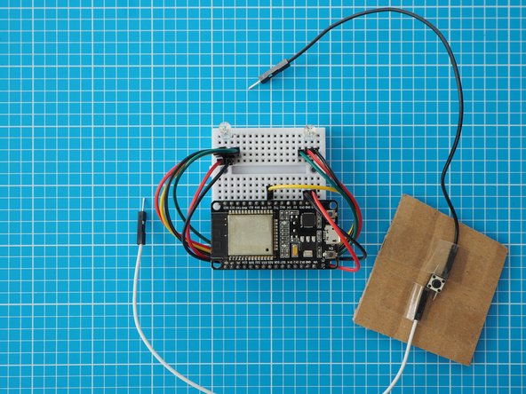 An external Button can be used instead of capacitive touch by adding a switch between pin D23 and GND on the ESP32.