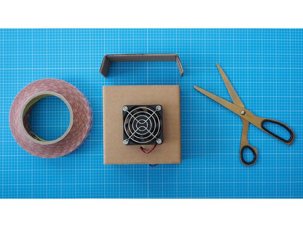 Fold the sides of the cardboard.