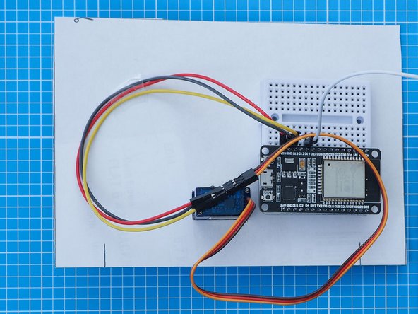 Mount the breadboard assembly onto the back of the mount following the position indicated on the paper template. The breadboard has a double sided tape backing which can be used to attach it.