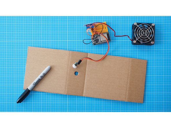 Gently enlarge the hole using a pencil.