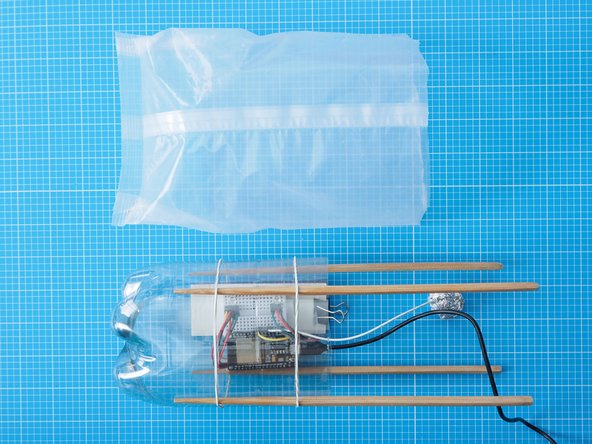 Cut the end off of a cereal liner and drape it over the top of the bottle