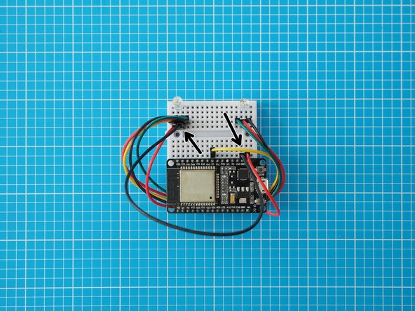 Add a wire in line with the LED's centre right leg (GND) and connect that to the ESP32 GND pin. This LED leg is the longer of the middle legs.