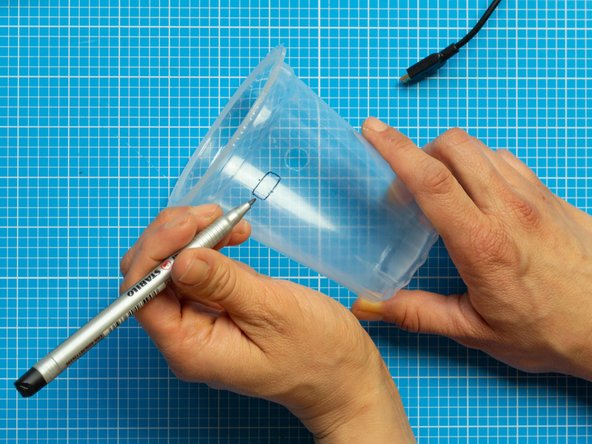 Pierce  the tub for the electronics using the small screwdriver. You can heat it as instructed for the first perforations.