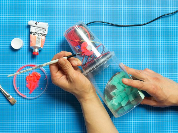 You can use Template No. 2 provided to try the background in the photo.  Cut and attach to the bottom tub with a small strips of double-sided tape.