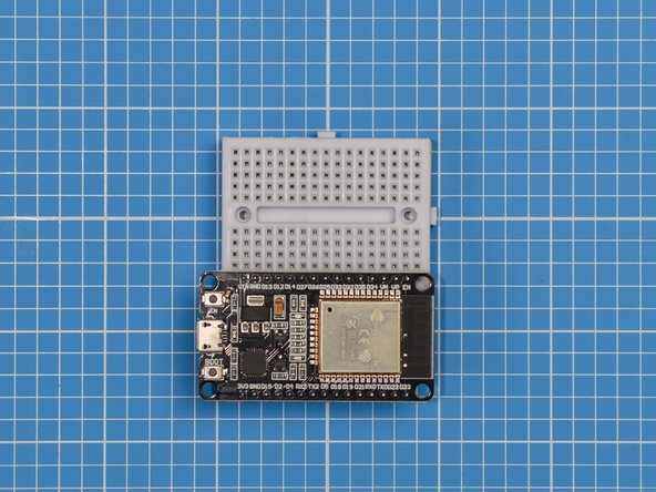 Place one side of the ESP32S onto the other side of the breadboard. The side used should be the same side as the button labelled EN.
