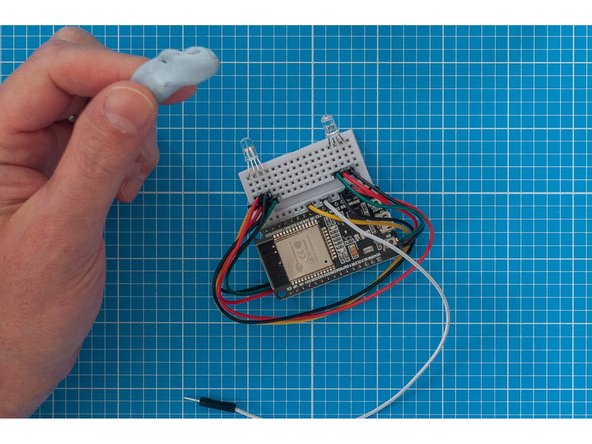 Take a generous piece of Blu Tack and stick it to the bottom of the assembly, on the opposite end to the LED's.