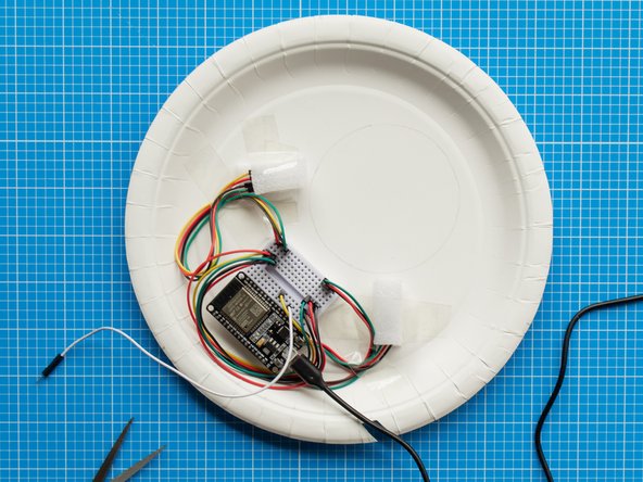 Make an opening in the shape of a slit with the help of scissors. The opening should be slightly wider than the cable.