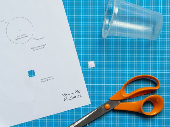 Cut the PIR sensor template from Template No. 1 and attach it to the top cup with sticky tape.