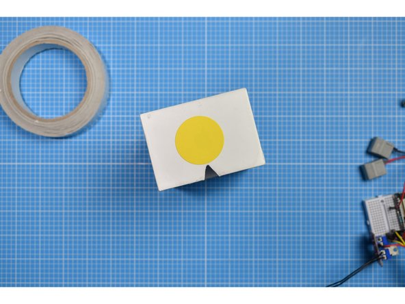 Close the box and make a small mark on the inner sleeve that traces the triangle you have just cut.