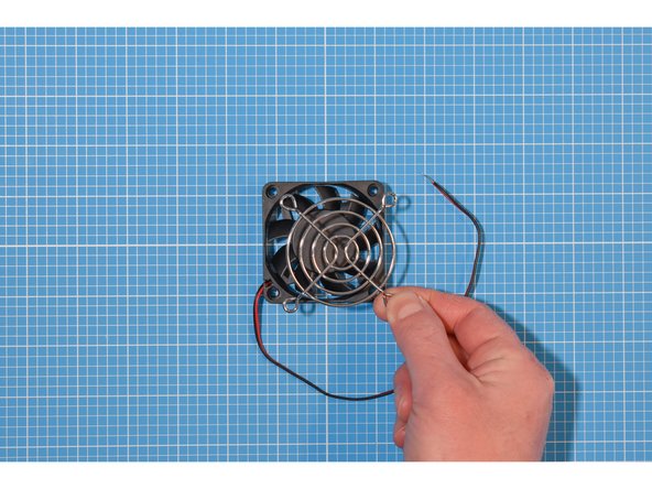 The fan will have been supplied with a metal grill, nuts and bolts.