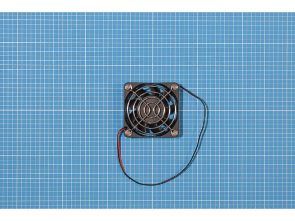 Place the grill on top of the fan, opposite to the side that has a label. The grill will be covering the finned hub that rotates.