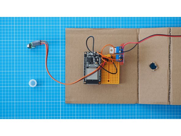 Remove the white plastic cap from the PIR sensor.