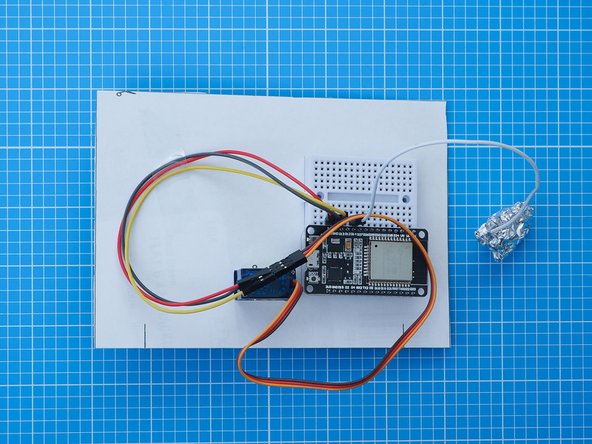Crumple a sheet of aluminium kitchen foil around the exposed metal on the end of the capacitive touch lead.