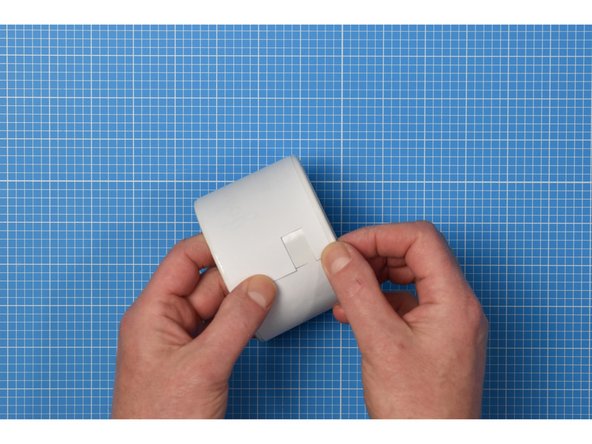 Starting with the straight end, carefully wrap the around the container, ensuring the notch is closer to the bottom of the container than the top. This notch will later become the hole for the USB cable to pass through.