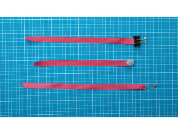 Create an end weight, using a safety pin, blue-tac, playdough or a small bulldog clip.