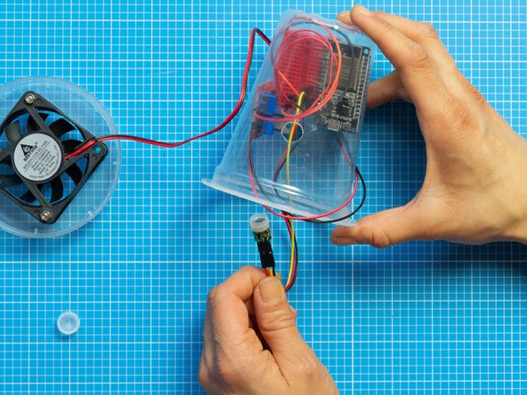 Remove the white plastic cap from the PIR sensor.