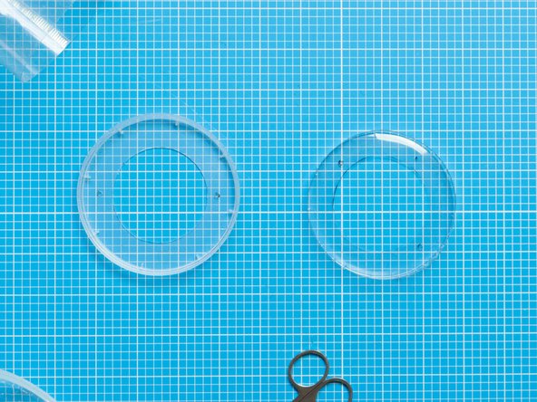 Take the lids from the top and bottom tub. Both should have matching holes.