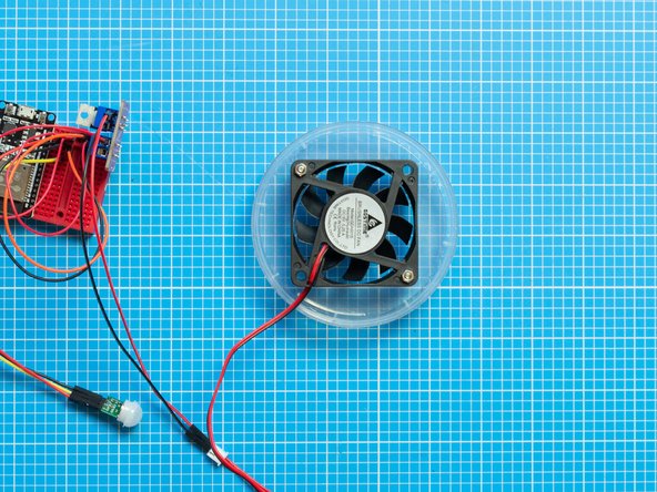 The screws should stick out from the top lid. Place the fan following the position of the screws and fix with the bolts.