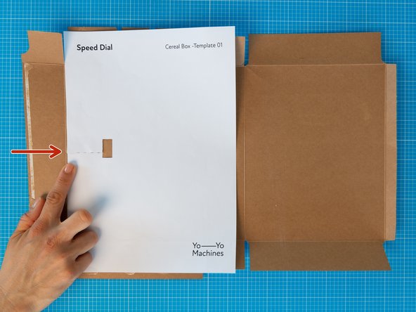 Place the box flat with the brown cardboard side facing up.