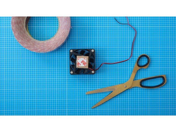 Add another piece of double sided tape to the top of the cardboard.