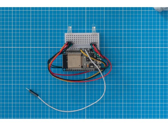The breadboard will be mounted upright inside the container, so we need to bend the LED's as shown in the image so that they will face the lid.