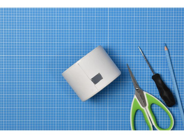 Use small scissors to careful cut the rectangle from the container side.