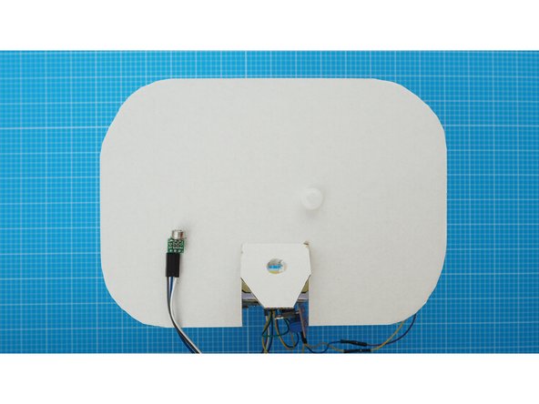 Remove the white plastic cap from the PIR sensor.