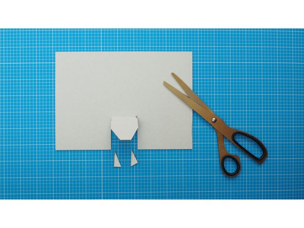 At the centre of the long edge mark a flap that is 40mm wide and 50mm deep with a fold line on the inner edge.