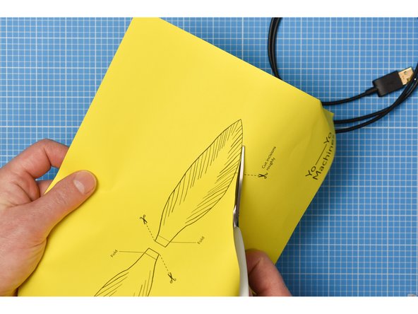 The feathers are best made from paper 80gsm or less. Thicker paper will put strain on the fan and slow it down.