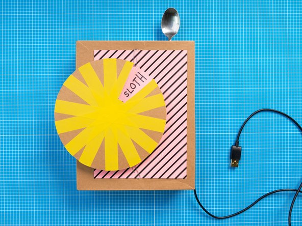 Mount the wheel onto the servo motor, making sure to align the opening and the top-most segment.