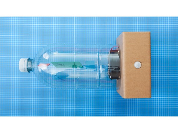 Place the bottle on top of the fan.