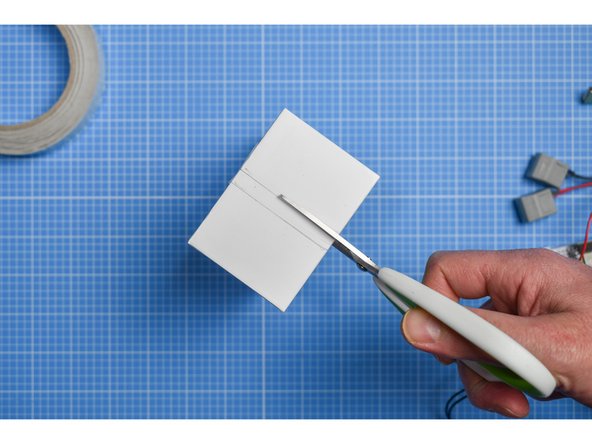 Using the mark you made in the previous step, mark and cut a slot in the inner sleeve large enough for the USB lead to pass through.