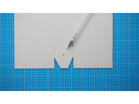 With a pen or pencil make a mark in the centre of the flap.