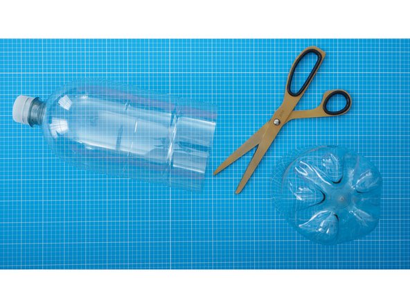 Cut the bottom from of a plastic bottle carefully with scissors and discard.