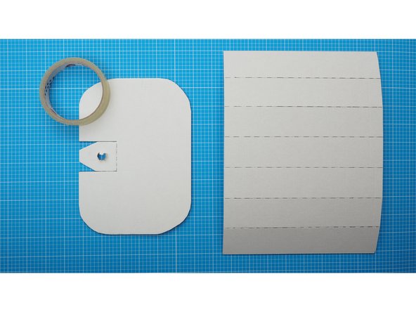 Position the curved base and the top as shown, making the sure the marked side of the curve is on the outside, and the marked section of the flap on the top piece is facing towards the curve