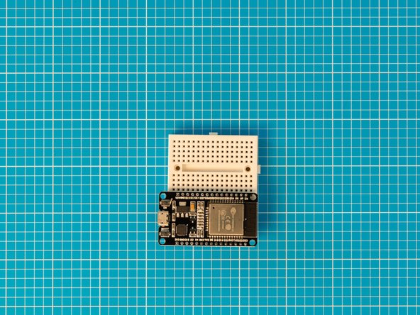 Make sure all the pins are lined up, leaving an empty hole on either side of the breadboard. Give the ESP32S a good solid push to plug it all the way into the breadboard.