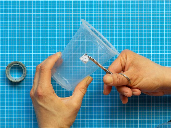 Make the circular hole with the help of small scissors.