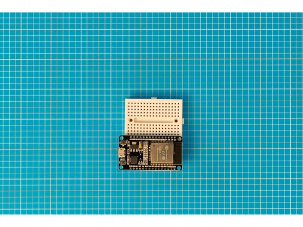 Place one side of the ESP32S onto the other side of the breadboard. The side used should be the same side as the button labelled EN.