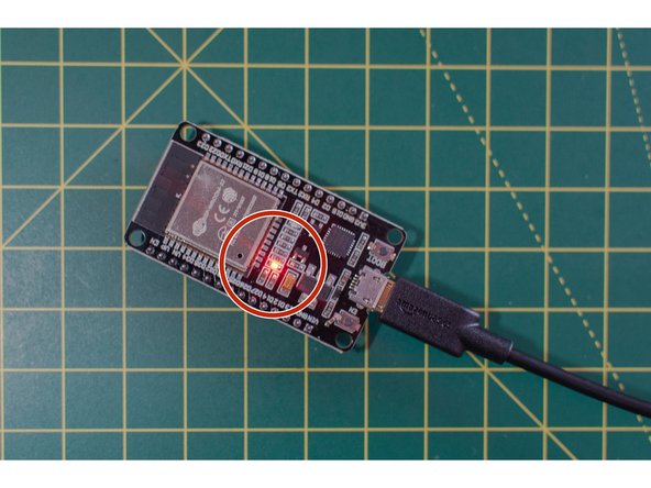 Plug your ESP32S board into your computer with the USB cable. You should see a red light on the board, which means it is powered up.