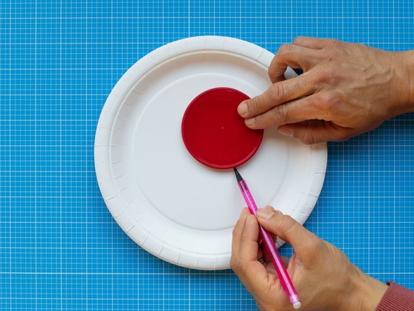 Mark a circular window of approximately 85 mm diameter in one plate. The circle should be located off centre to allow space for storing the electronics.