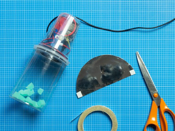 Try different paper backgrounds for the bottom tub.  Mirror card can reflect and duplicate the foam bits as they jump.