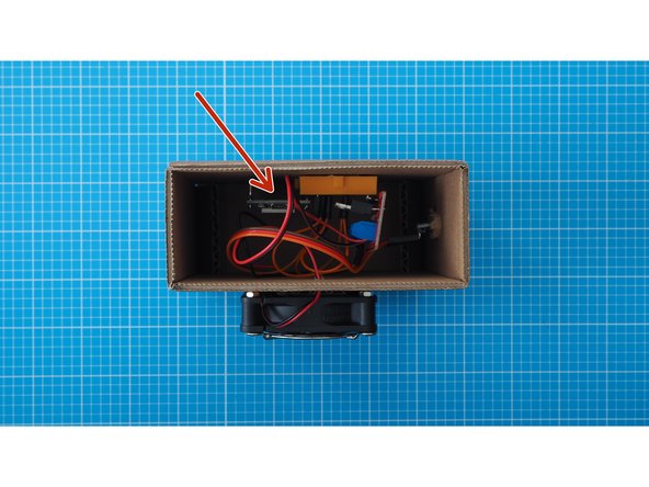 You can leave the other side of the cardboard enclosure open for easy access.