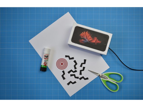 Knock Knock can be decorated however you wish. The following steps demonstrate how to cover the box with white card and apply graphics from the our printable PDF